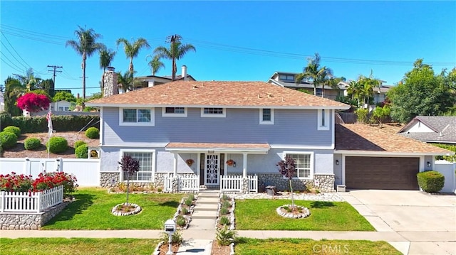 415 Buttonwood Dr, Brea, CA 92821 - traditional-style home featuring stone siding, an attached garage, concrete driveway, and a porch