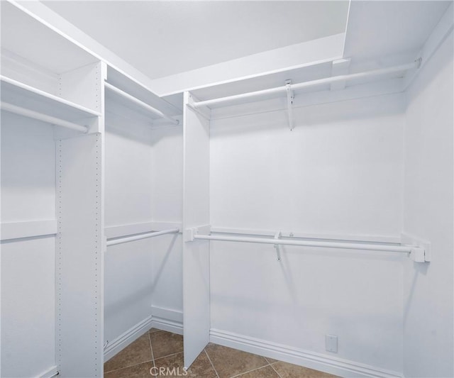 415 Buttonwood Dr, Brea, CA 92821 - spacious closet featuring dark tile patterned flooring
