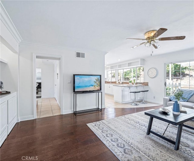 415 Buttonwood Dr, Brea, CA 92821 - living room with crown molding, a ceiling fan, and light wood-style floors