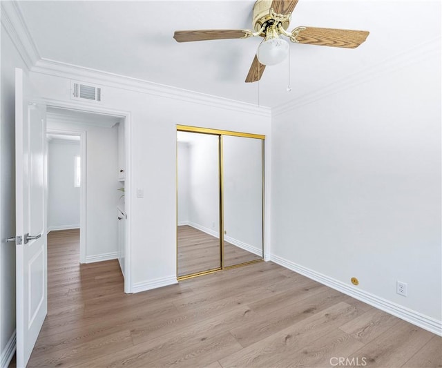 415 Buttonwood Dr, Brea, CA 92821 - unfurnished bedroom featuring light wood finished floors, a closet, crown molding, and ceiling fan