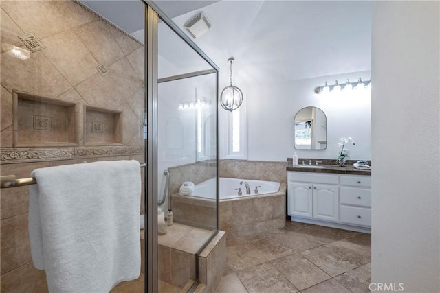 415 Buttonwood Dr, Brea, CA 92821 - bathroom with vanity, a garden tub, a stall shower, and a chandelier