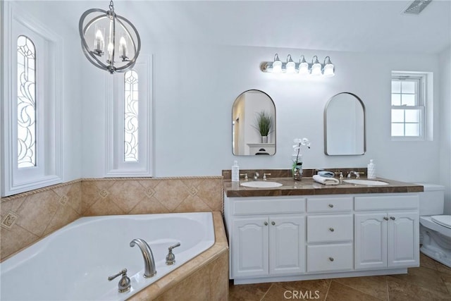 415 Buttonwood Dr, Brea, CA 92821 - bathroom with double vanity, a bath, a chandelier, and tile patterned floors