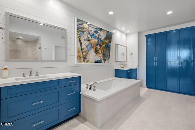 1437 Windshore Way, Oxnard, CA 93035 - bathroom with two vanities, a garden tub, and recessed lighting