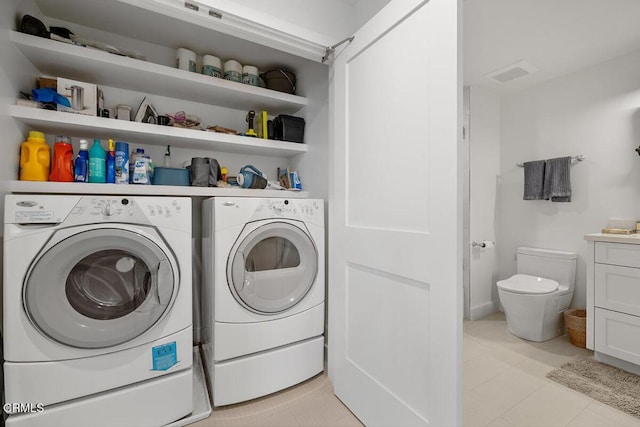 1437 Windshore Way, Oxnard, CA 93035 - washroom featuring washer and clothes dryer and light tile patterned flooring