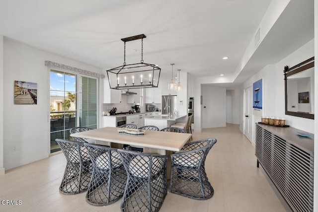 1437 Windshore Way, Oxnard, CA 93035 - dining space with a barn door, recessed lighting, and a chandelier