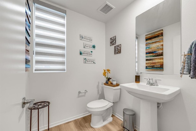 5261 Beachfront Cove St # 174, San Diego, CA 92154 - bathroom with wood finished floors and toilet