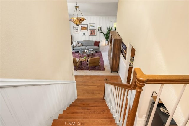 3602 E Ridgeway Rd, Orange, CA 92867 - stairway featuring wood finished floors and a chandelier