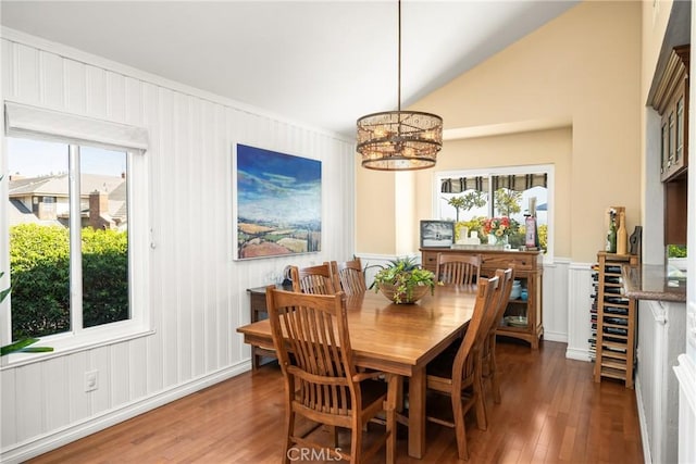 3602 E Ridgeway Rd, Orange, CA 92867 - dining room with hardwood / wood-style flooring, a chandelier, a decorative wall, healthy amount of natural light, and lofted ceiling