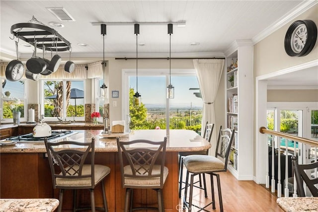 3602 E Ridgeway Rd, Orange, CA 92867 - dining room featuring light wood-style floors, crown molding, and healthy amount of natural light