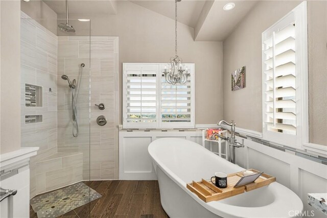 3602 E Ridgeway Rd, Orange, CA 92867 - full bath featuring a soaking tub, a walk in shower, wood finished floors, a chandelier, and a wainscoted wall