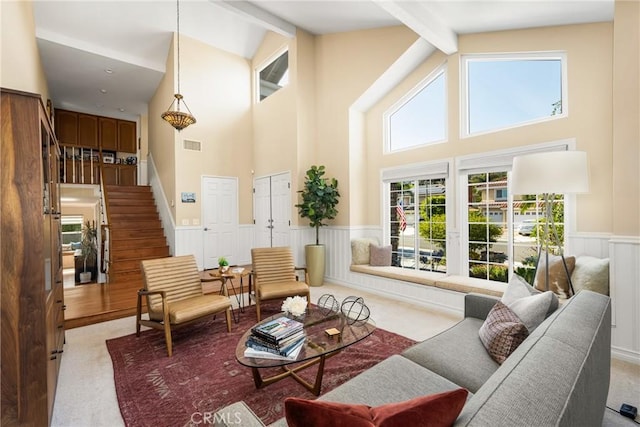 3602 E Ridgeway Rd, Orange, CA 92867 - living area featuring carpet floors, beamed ceiling, high vaulted ceiling, wainscoting, and stairs
