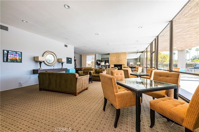1111 E Ramon Rd Unit 37, Palm Springs, CA 92264 - dining space with light carpet and expansive windows