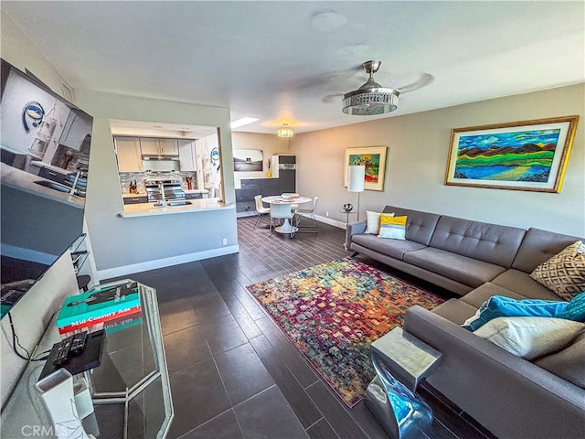 1111 E Ramon Rd Unit 37, Palm Springs, CA 92264 - living room with baseboards and dark wood-type flooring