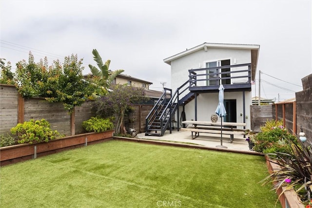 1164 12th St, Los Osos, CA 93402 - back of house with a fenced backyard and stairway