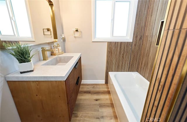 10113 Dorset, Rancho Cucamonga, CA 91730 - full bath with vanity, wood finished floors, a tub, and healthy amount of natural light