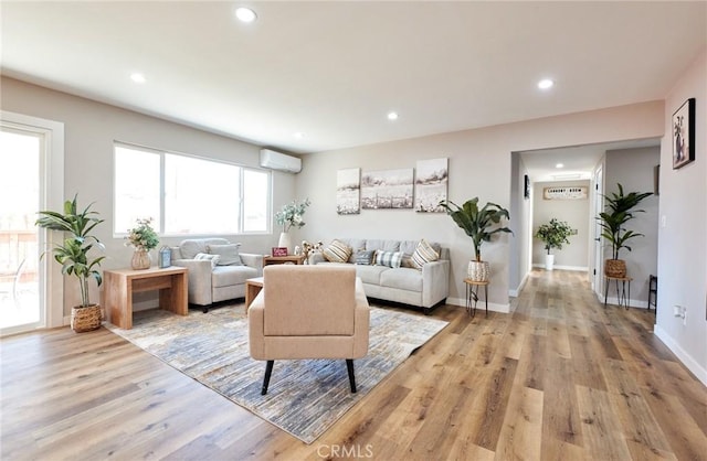 10113 Dorset, Rancho Cucamonga, CA 91730 - living room featuring a wall mounted AC, recessed lighting, and light wood finished floors