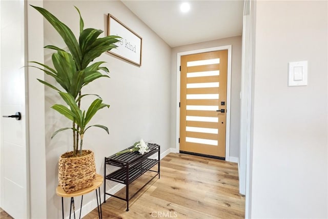 10113 Dorset, Rancho Cucamonga, CA 91730 - doorway to outside with wood finished floors and baseboards