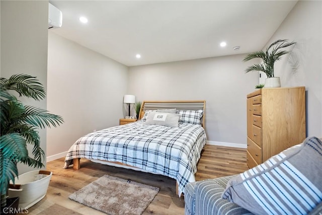 10113 Dorset, Rancho Cucamonga, CA 91730 - bedroom with wood finished floors, recessed lighting, and a wall unit AC