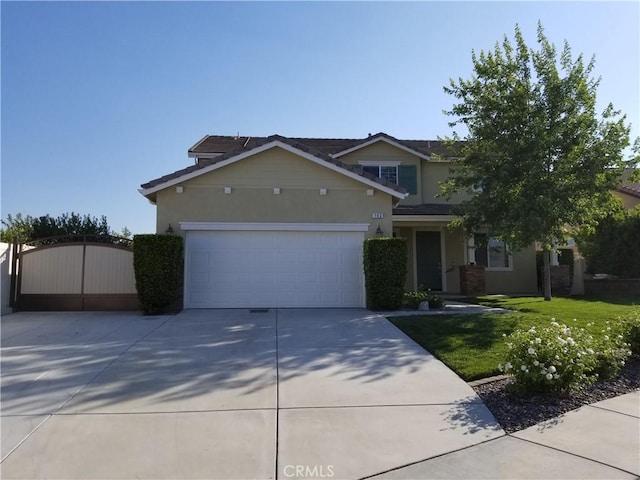 102 Mesa Ct, Calimesa, CA 92320 - view of front of house featuring concrete driveway, stucco siding, a gate, an attached garage, and a front yard