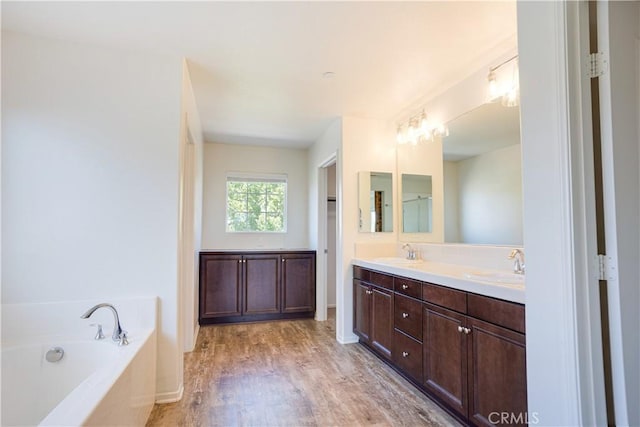 102 Mesa Ct, Calimesa, CA 92320 - full bathroom with double vanity, a bath, and wood finished floors