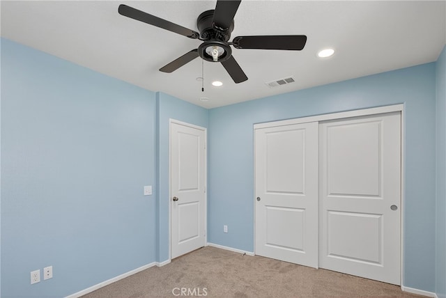 102 Mesa Ct, Calimesa, CA 92320 - unfurnished bedroom featuring light colored carpet, a closet, recessed lighting, and ceiling fan