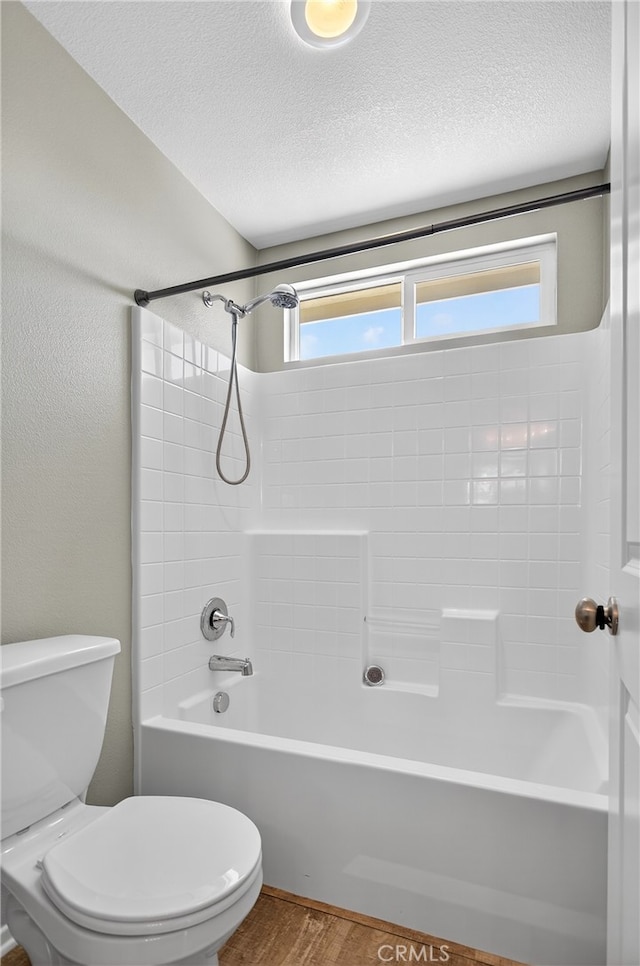102 Mesa Ct, Calimesa, CA 92320 - bathroom featuring bathing tub / shower combination, wood finished floors, and a textured ceiling