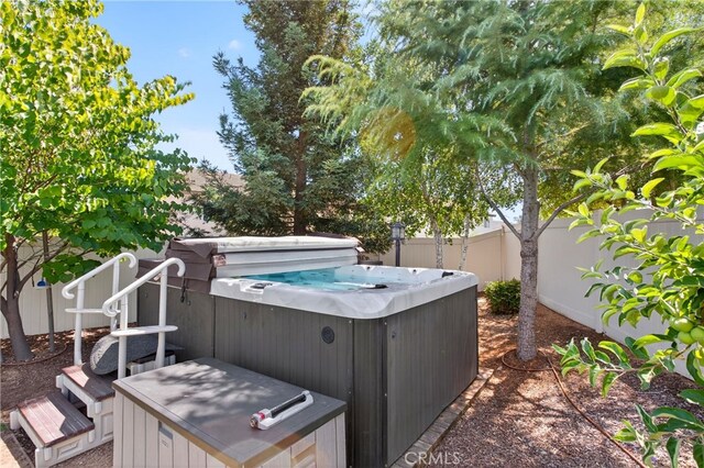 102 Mesa Ct, Calimesa, CA 92320 - fenced backyard featuring a hot tub