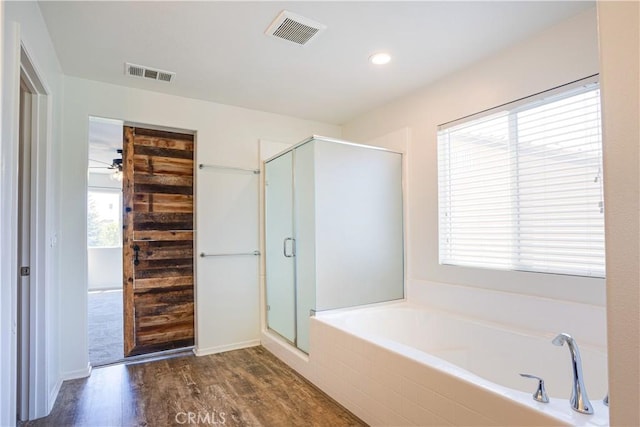 102 Mesa Ct, Calimesa, CA 92320 - full bath with a bath, wood finished floors, a stall shower, and healthy amount of natural light