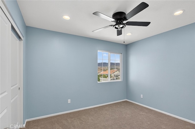 102 Mesa Ct, Calimesa, CA 92320 - unfurnished bedroom featuring carpet floors, a closet, recessed lighting, and ceiling fan