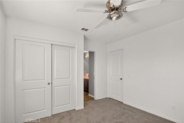 102 Mesa Ct, Calimesa, CA 92320 - unfurnished bedroom with carpet floors, a closet, and a ceiling fan