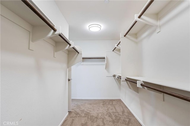102 Mesa Ct, Calimesa, CA 92320 - walk in closet featuring light carpet
