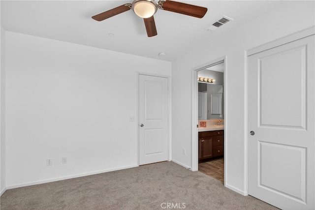 102 Mesa Ct, Calimesa, CA 92320 - unfurnished bedroom featuring light colored carpet, connected bathroom, and ceiling fan