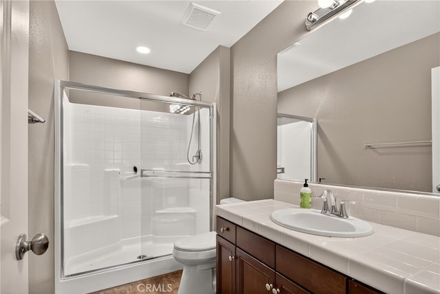 102 Mesa Ct, Calimesa, CA 92320 - full bath with a shower stall, vanity, tasteful backsplash, and wood finished floors
