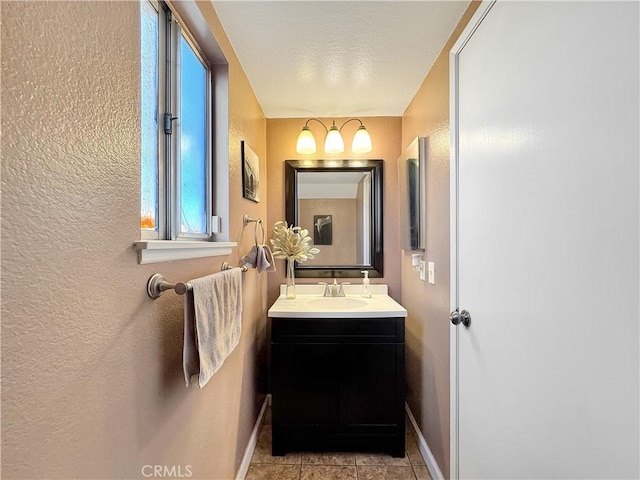 11700 White Pine Ct, Fontana, CA 92337 - bathroom featuring vanity, a textured wall, and tile patterned flooring