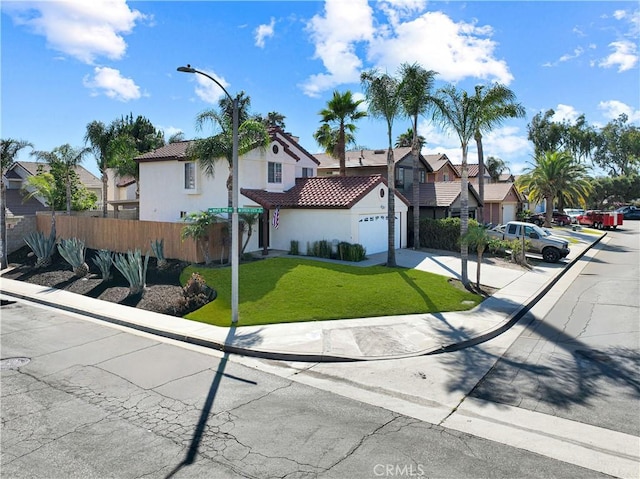 11700 White Pine Ct, Fontana, CA 92337 - view of front facade with a tiled roof, stucco siding, a residential view, a garage, and concrete driveway