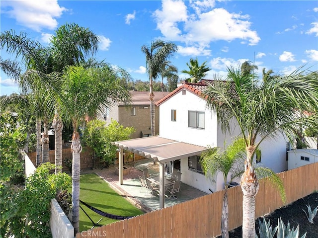 11700 White Pine Ct, Fontana, CA 92337 - rear view of property featuring a fenced backyard, stucco siding, and a patio