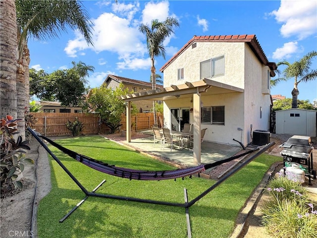 11700 White Pine Ct, Fontana, CA 92337 - rear view of property featuring stucco siding, a shed, a patio, and a tiled roof