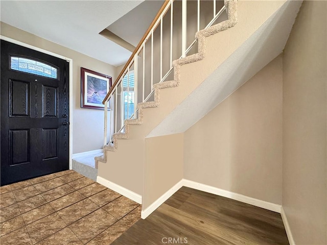 11700 White Pine Ct, Fontana, CA 92337 - foyer featuring stairway and wood finished floors