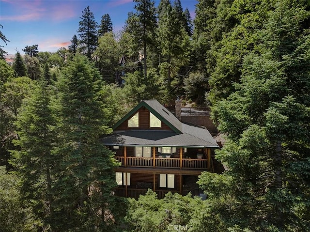 25148 Scenic View Dr, Crestline, CA 92325 - rear view of property with a balcony and a wooded view