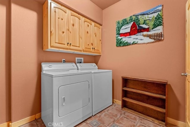 25148 Scenic View Dr, Crestline, CA 92325 - washroom featuring washing machine and clothes dryer, cabinet space, and light tile patterned floors