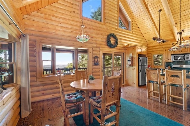 25148 Scenic View Dr, Crestline, CA 92325 - dining space with a wooden ceiling with exposed beams, high vaulted ceiling, log walls, wood finished floors, and plenty of natural light