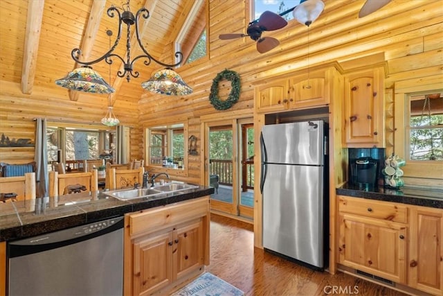 25148 Scenic View Dr, Crestline, CA 92325 - kitchen with appliances with stainless steel finishes, a wooden ceiling with exposed beams, rustic walls, wood finished floors, and ceiling fan