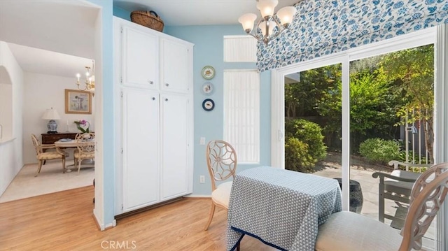 3620 Daffodil Ave Unit 31, Corona Del Mar, CA 92625 - dining space with a chandelier and light wood-style flooring