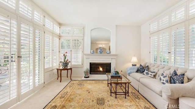 3620 Daffodil Ave Unit 31, Corona Del Mar, CA 92625 - carpeted living room with healthy amount of natural light and a brick fireplace