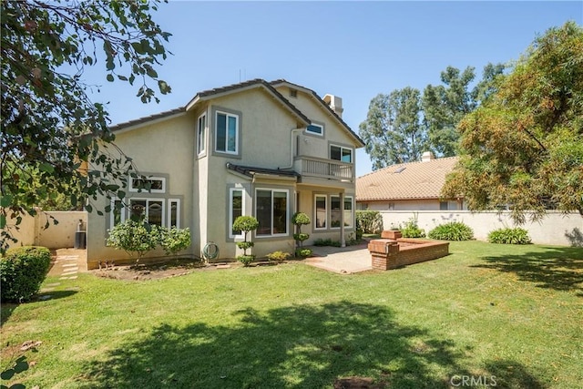9320 Isaac Lord Dr, Rancho Cucamonga, CA 91701 - back of property featuring a patio area, a fenced backyard, stucco siding, and a balcony