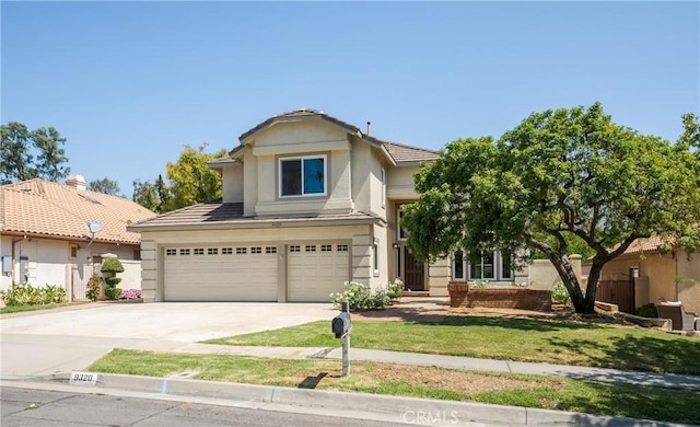 9320 Isaac Lord Dr, Rancho Cucamonga, CA 91701 - traditional home with concrete driveway, an attached garage, a front yard, and stucco siding
