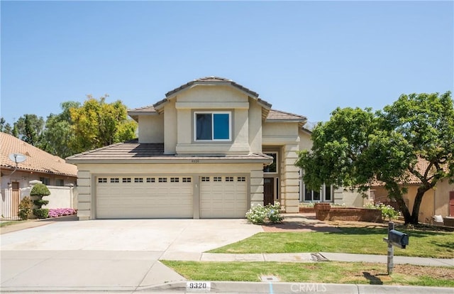 9320 Isaac Lord Dr, Rancho Cucamonga, CA 91701 - view of front of home featuring concrete driveway, a garage, stucco siding, and a tiled roof