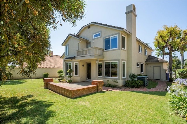 9320 Isaac Lord Dr, Rancho Cucamonga, CA 91701 - rear view of property featuring a balcony, a fenced backyard, a chimney, stucco siding, and a patio
