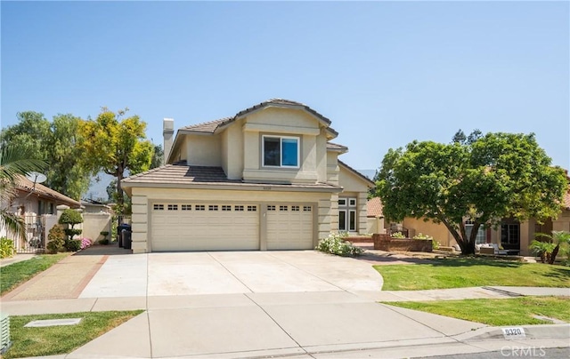 9320 Isaac Lord Dr, Rancho Cucamonga, CA 91701 - traditional-style house featuring a garage, concrete driveway, stucco siding, a tile roof, and a front yard