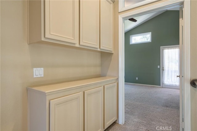 9320 Isaac Lord Dr, Rancho Cucamonga, CA 91701 - hallway featuring vaulted ceiling and light carpet